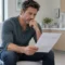 Man reviewing his blood test results during a TRT follow-up consultation